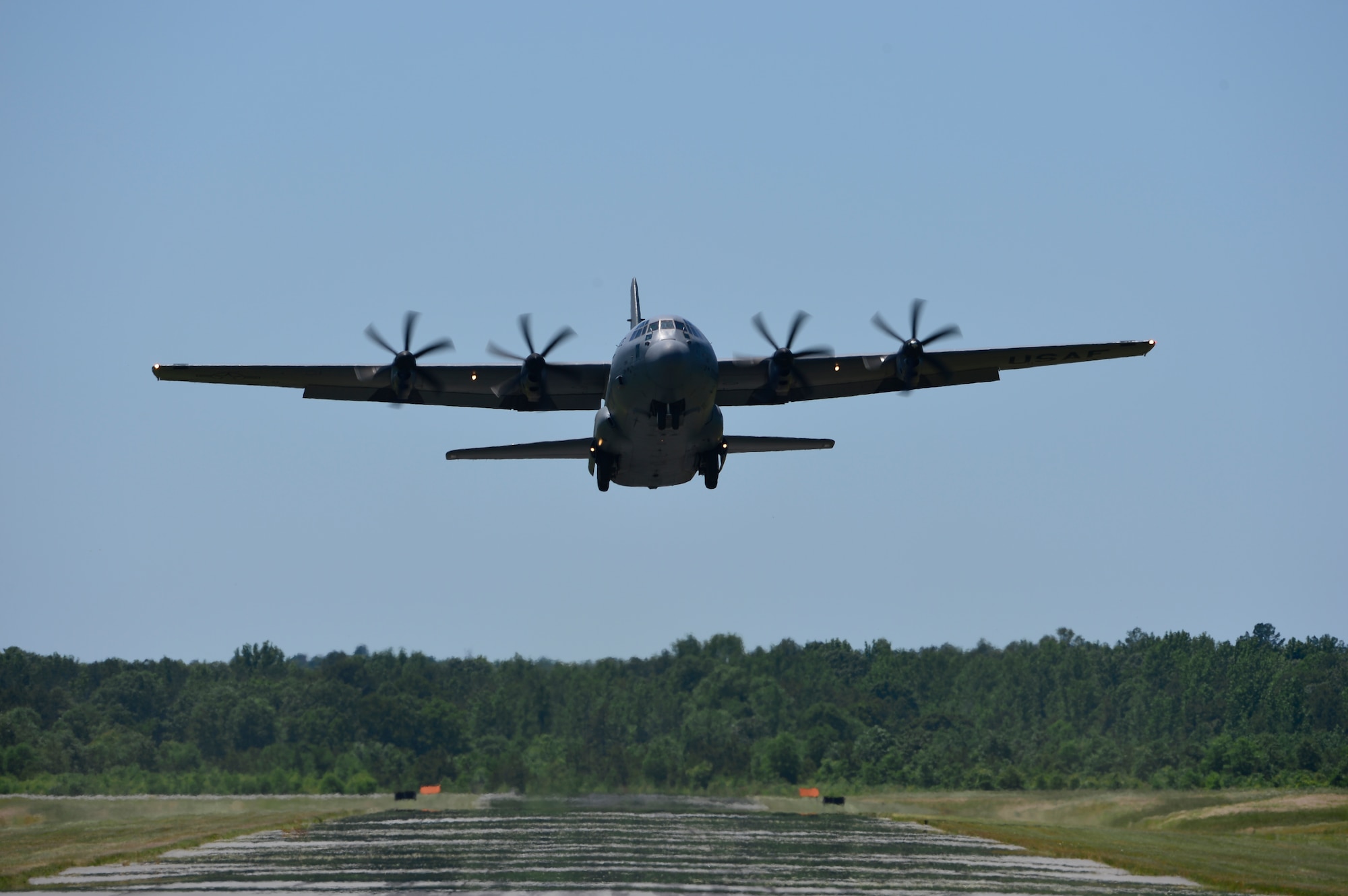 A C-130J assigned to the 19th Airlift Wing takes off at the All-American Landing Zone competeing in the assault landing portion of the “Turkey Shoot” May 13th, 2016, at Camp Robinson, Ark. Six units from Team Little Rock participated in this iteration with the overarching objective to hone combat airlift fundamentals. (U.S. Air Force photo by Staff Sgt. Jeremy McGuffin)
