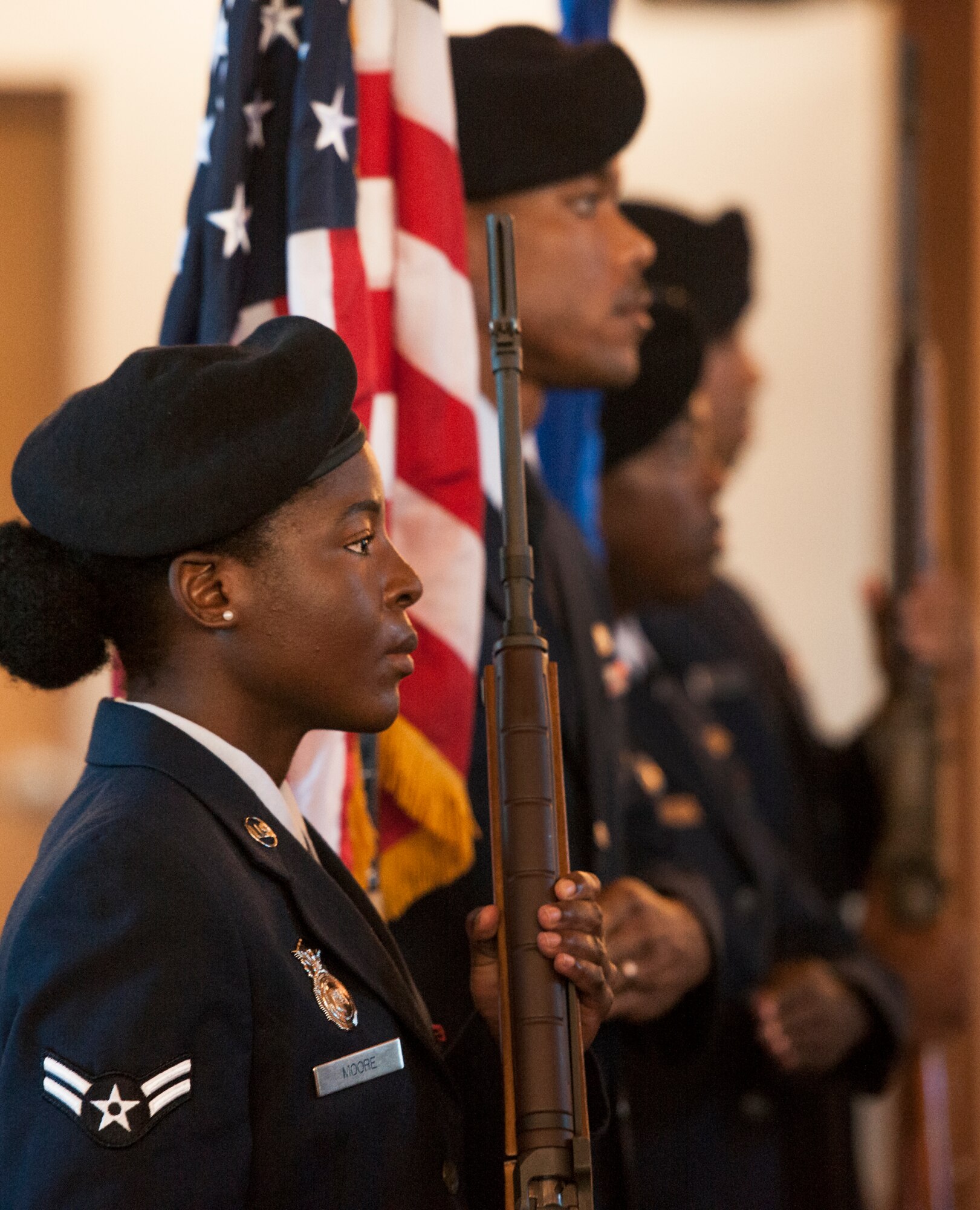 Airman 1st Class Delise Moore and three other 96th Security Forces Squadron Airmen perform the flag detail for the candle light vigil May 19 at Eglin Air Force Base, Fla.  The ceremony was held to honor the fallen police, defenders and agents from the previous year during National Police Week.  Nine candles were lit in remembrance including one for Okaloosa County Sheriff’s Deputy Bill Myers and Special Agent Adrianna Vorderbruggen.  (U.S. Air Force photo/Samuel King Jr.)