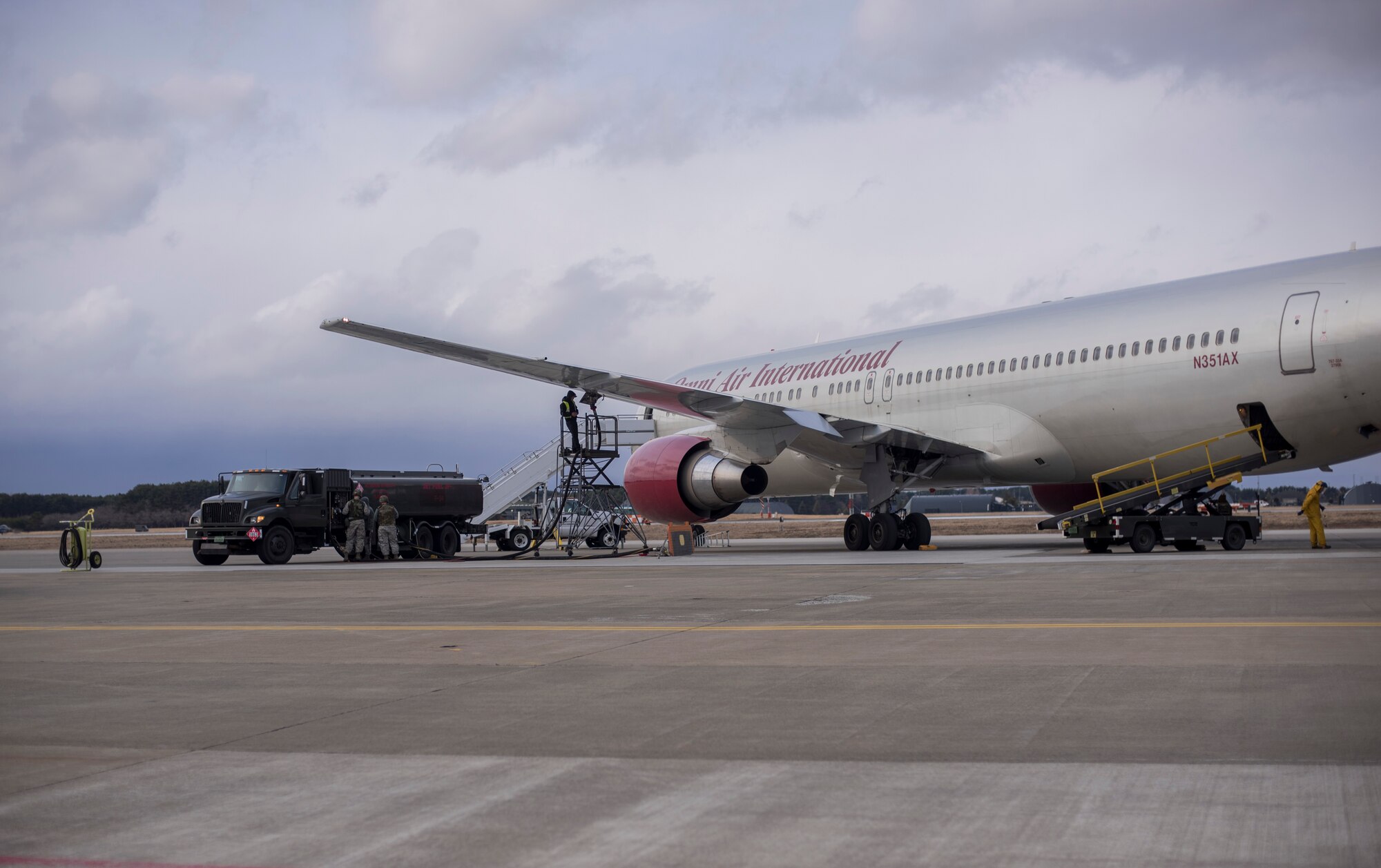 Airmen with the 35th Logistics Readiness Squadron refuel a Boeing 767 at Misawa Air Base, Japan, March 22, 2016. The Hydrant Mobile Refueler system attaches to R-11 fuel trucks which are capable of refueling most aircraft. The HYMORE system helps cut down refueling wait times. (U.S. Air Force photo by Senior Airman Brittany A. Chase)