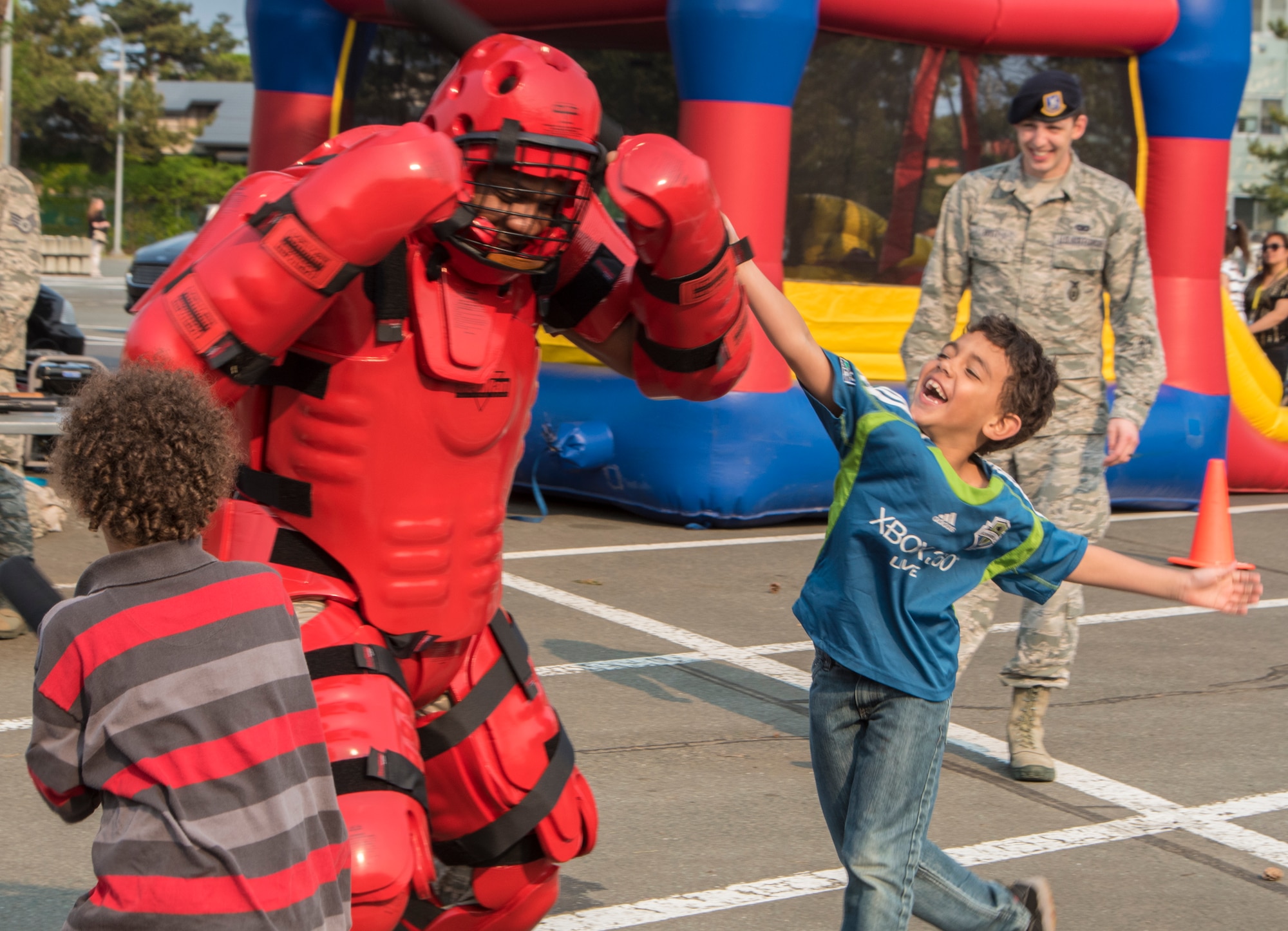 U.S. Air Force Staff Sgt. Marreese Blunt, a trainer with the 35th Security Forces Squadron, wears a protective suit as participants of Police Week practice defensive techniques at Misawa Air Base, Japan, May 19, 2016. Police Week, established in 1962 by President John F. Kennedy, honors police officers who lost their lives in the line of duty. (U.S. Air Force photo by Airman 1st Class Jordyn Fetter) 