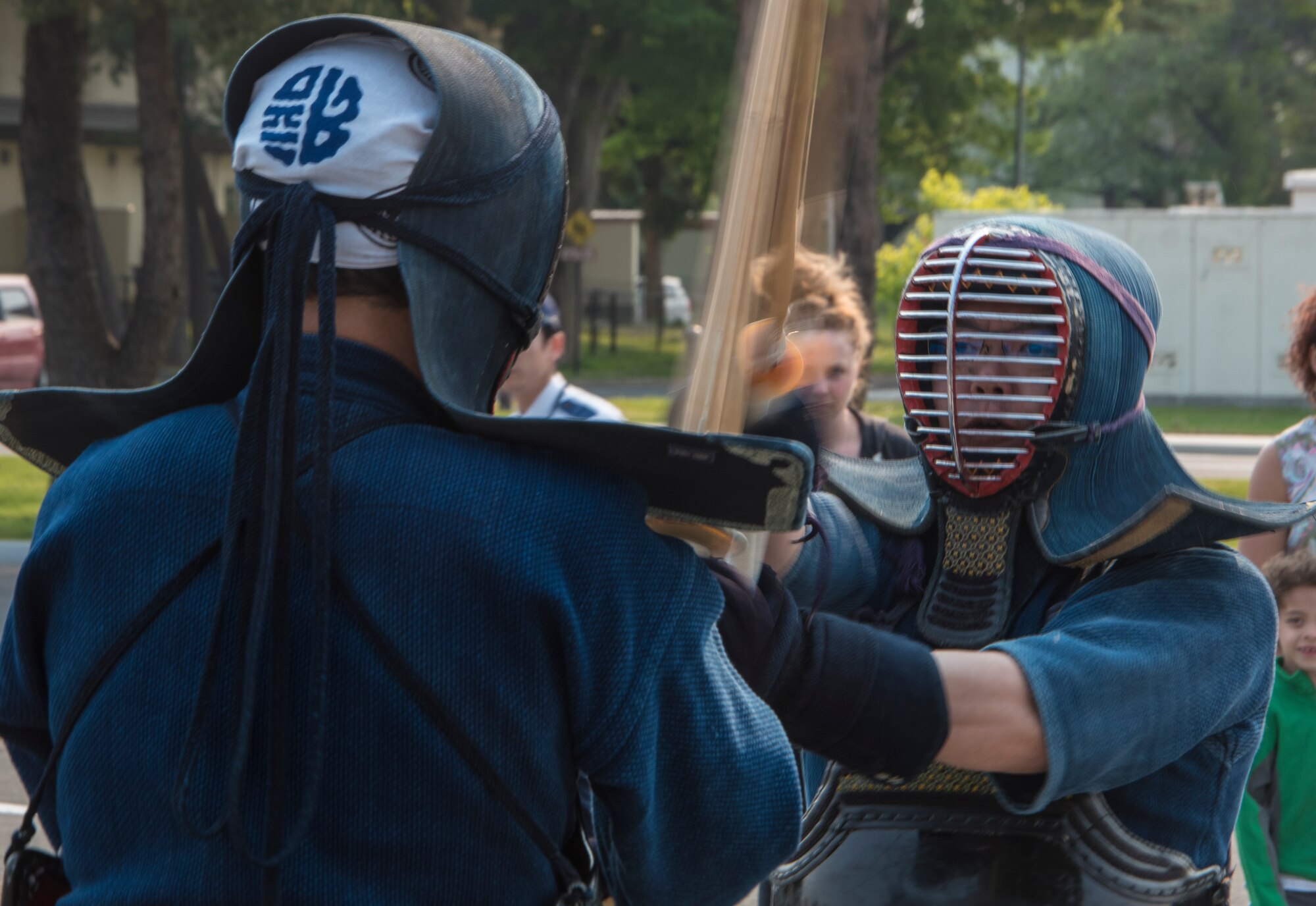 Kenji Hirose, inspector and chief of administration section of the Misawa Police Station, and Kazuma Yoneya, inspector and sub-section chief of public security section of the Misawa Police Station, perform Kendo techniques as part of Police Week at Misawa Air Base, Japan, May 19, 2016. Throughout the week, 35th Security Forces Squadron members challenged themselves during a memorial ruck march, an Airmen versus NCO football game and a race, which tested their physical fitness, knowledge and teamwork skills. (U.S. Air Force photo by Airman 1st Class Jordyn Fetter)