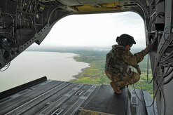 U.S. Army Sgt. King David, 1st Battalion, 228th Aviation Regiment CH-47 Chinook Crew Chief, looks out over Managua, the capital of Nicaragua, where the Joint Task Force-Bravo U.S. Southern Command Situational Assessment Team from Soto Cano Air Base, Honduras, was invited to demonstrate their disaster response assistance capabilities to the Nicaraguan Civil Defense and U.S. Embassy, Managua, Community Emergency Response Team May 17, 2016 in Managua, Nicaragua. The S-SAT is comprised of a team leader, civil military operations officer, air operations planer, engineer operations planner, logistics planner, communications planner, medical planner and force protection planner who provide critical information to governmental disaster response teams so they know what to expect and plan for when they arrive. (U.S. Air Force Photo by Capt. David Liapis)
