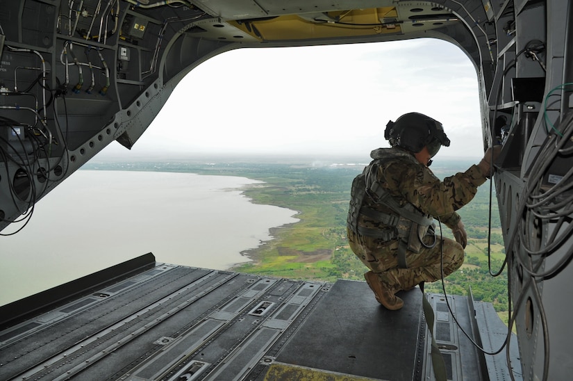 U.S. Army Sgt. King David, 1st Battalion, 228th Aviation Regiment CH-47 Chinook Crew Chief, looks out over Managua, the capital of Nicaragua, where the Joint Task Force-Bravo U.S. Southern Command Situational Assessment Team from Soto Cano Air Base, Honduras, was invited to demonstrate their disaster response assistance capabilities to the Nicaraguan Civil Defense and U.S. Embassy, Managua, Community Emergency Response Team May 17, 2016 in Managua, Nicaragua. The S-SAT is comprised of a team leader, civil military operations officer, air operations planer, engineer operations planner, logistics planner, communications planner, medical planner and force protection planner who provide critical information to governmental disaster response teams so they know what to expect and plan for when they arrive. (U.S. Air Force Photo by Capt. David Liapis)
