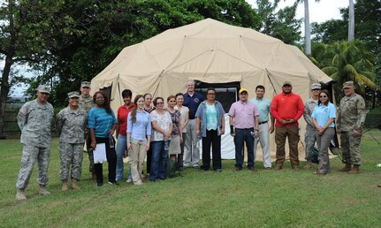 Members of the Joint Task Force-Bravo U.S. Southern Command Situational Assessment Team element, based out of Soto Cano Air Base, Honduras, and the U.S. Embassy, Managua, Community Emergency Response Team gather for a group photo after an S-SAT demonstration in Managua, Nicaragua, May 17, 2016. The S-SAT team was invited to demonstrate the disaster response assistance capabilities they can provide to all seven Central American nations. The JTF-Bravo S-SAT is designed to be able to depart Soto Cano Air Base within 18 hours of notification of an approved request for assistance that originates from a partner nation by means of the respective U.S. Embassy and U.S. SOUTHCOM. (U.S. Air Force Photo by Capt. David Liapis)