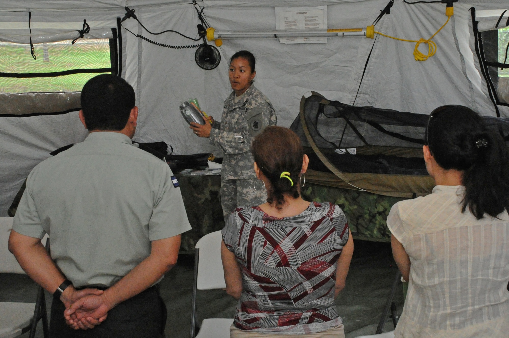 U.S. Army Maj. Gennelle Lee, U.S. Southern Command Situational Assessment Team operations officer, showcases the contents of an S-SAT “go-bag” to Nicaraguan Civil Defense and U.S. Embassy, Managua, Community Emergency Response Team members May 17, 2016 in Managua, Nicaragua. The team was invited to demonstrate the disaster response assistance capabilities they can provide to all seven Central American nations. The JTF-Bravo S-SAT is designed to be able to depart Soto Cano Air Base within 18 hours of notification of an approved request for assistance that originates from a partner nation by means of the respective U.S. Embassy and U.S. SOUTHCOM. (U.S. Air Force Photo by Capt. David Liapis)