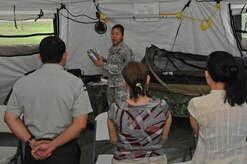 U.S. Army Maj. Gennelle Lee, U.S. Southern Command Situational Assessment Team operations officer, showcases the contents of an S-SAT “go-bag” to Nicaraguan Civil Defense and U.S. Embassy, Managua, Community Emergency Response Team members May 17, 2016 in Managua, Nicaragua. The team was invited to demonstrate the disaster response assistance capabilities they can provide to all seven Central American nations. The JTF-Bravo S-SAT is designed to be able to depart Soto Cano Air Base within 18 hours of notification of an approved request for assistance that originates from a partner nation by means of the respective U.S. Embassy and U.S. SOUTHCOM. (U.S. Air Force Photo by Capt. David Liapis)