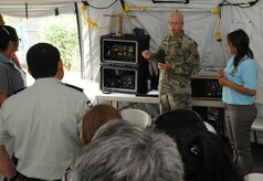 U.S. Army Staff Sgt. Jayson Toohey, Joint Task Force-Bravo communications officer, describes his role in the self-sufficient capabilities of the nine-person U.S. Southern Command Situational Assessment Team that was invited to demonstrate their disaster response assistance capabilities to the Nicaraguan Civil Defense and U.S. Embassy, Managua, Community Emergency Response Team May 17, 2016 in Managua, Nicaragua. The S-SAT is comprised of a team leader, civil military operations officer, air operations planer, engineer operations planner, logistics planner, communications planner, medical planner and force protection planner who provide critical information to governmental disaster response teams so they know what to expect and plan for when they arrive. (U.S. Air Force Photo by Capt. David Liapis)
