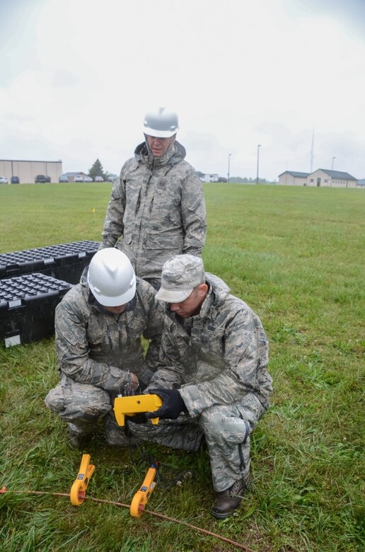 Citizen-Airmen from the Missouri Air National Guard's 239th Combat Communication Squadron work on setting up the ground for communications at Camp Clark, Missouri, on May 16, 2016. Before the Airmen can set up the antennae for communications they have to test the resistance to make sure the equipment and personnel are protected from weather elements that may be present in real state emergency duty assignments. (U.S. Air National Guard photo by Staff Sgt. Brittany Cannon)

