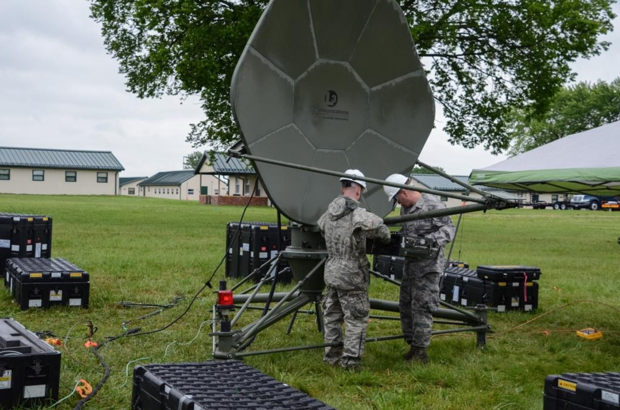 Tech. Sgt. Russell Riis, team chief of radio frequency, and Staff Sgt. Christopher Poston, a radio frequency transmission craftsman, both from the 239th Combat Communications Squadron in the Missouri Air National Guard work to set up the ground multi-work terminal for their communication capabilities at Camp Clark, Missouri, on May 16, 2016. The 239th CCS is at Camp Clark to support Annual Training for multiple Air National Guard units across the state training for potential state emergency duty. (U.S. Air National Guard photo by Staff Sgt. Brittany Cannon)