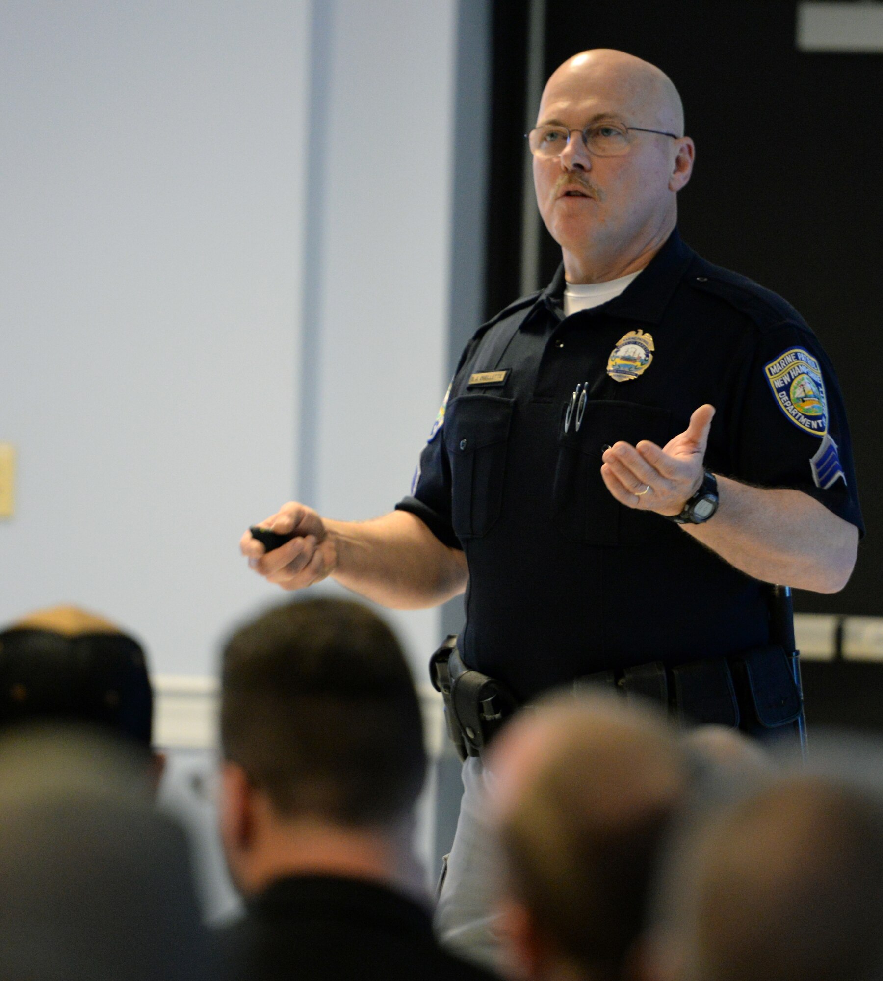 Sergeant D.J. Ouellette, New Hampshire Marine Patrol officer, discusses boater safety with members of the 157th Air Refueling Wing, during the 2016 Wing Safety Down Day, Pease Air National Guard Base, N.H., May 20, 2016.  The event which also included a barbecue, included other topics such as vehicle safety and accidents, and lightning safety. (U.S. Air National Guard photo by Staff Sgt. Curtis J. Lenz