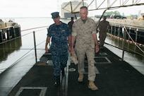 Marine Corps Gen. Joe Dunford, right, chairman of the Joint Chiefs of Staff, walks with Navy Rear Adm. Randy B. Crites, commander of Submarine Group 10, for a tour of the Ohio-class ballistic missile submarine USS Alaska at Naval Submarine Base Kings Bay, Ga., May 20, 2016. DoD photo by D. Myles Cullen