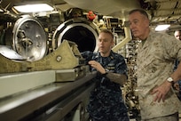 Marine Corps Gen. Joe Dunford, chairman of the Joint Chiefs of Staff, receives a briefing on the torpedo system aboard the USS Alaska at Naval Submarine Base Kings Bay, Ga., May 20, 2016. DoD photo by D. Myles Cullen