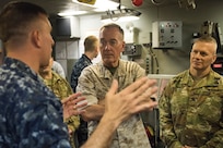 Marine Corps Gen. Joe Dunford, chairman of the Joint Chiefs of Staff, and Army Command Sgt. Maj. John W. Troxell, right, the chairman's senior enlisted advisor, receive a briefing on submarine training at the Trident Training Facility at Naval Submarine Base Kings Bay, Ga., May 20, 2016. DoD photo by D. Myles Cullen