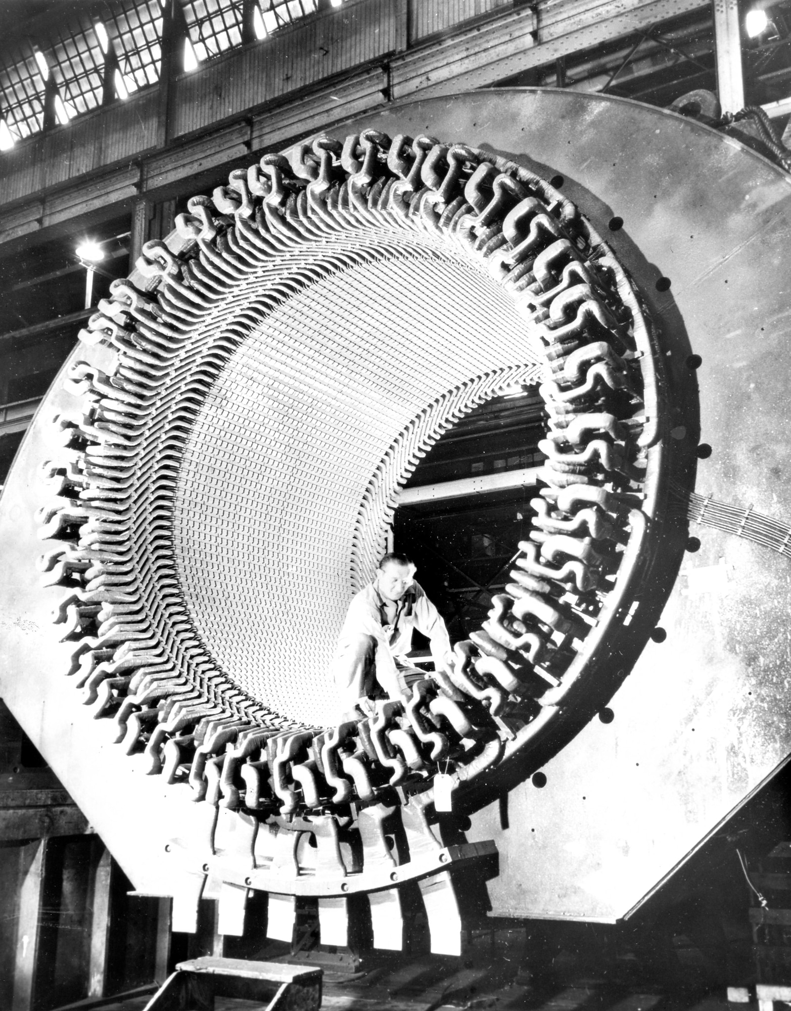 This photo shows the original M4 stator for the Propulsion Wind Tunnel Facility at AEDC during its original construction. The caption released with the photo Jan. 18, 1953, reads, “A workman is dwarfed by the 72-ton stator (stationary outer frame) for the world’s most powerful motor, being built at the Westinghouse East Pittsburgh Plant for new wind tunnels of the Arnold Engineering Development Center. There will be two such electrical giants, each rated at 83,000 horse-power, and weighing 225 tons apiece, for use in new transonic and supersonic wind tunnels, in which compressors will force air through special units at the speed of sound and higher.” This original stator was recently replaced as part of an improvement project for the Propulsion Wind Tunnel Main Drive. (Courtesy photo)