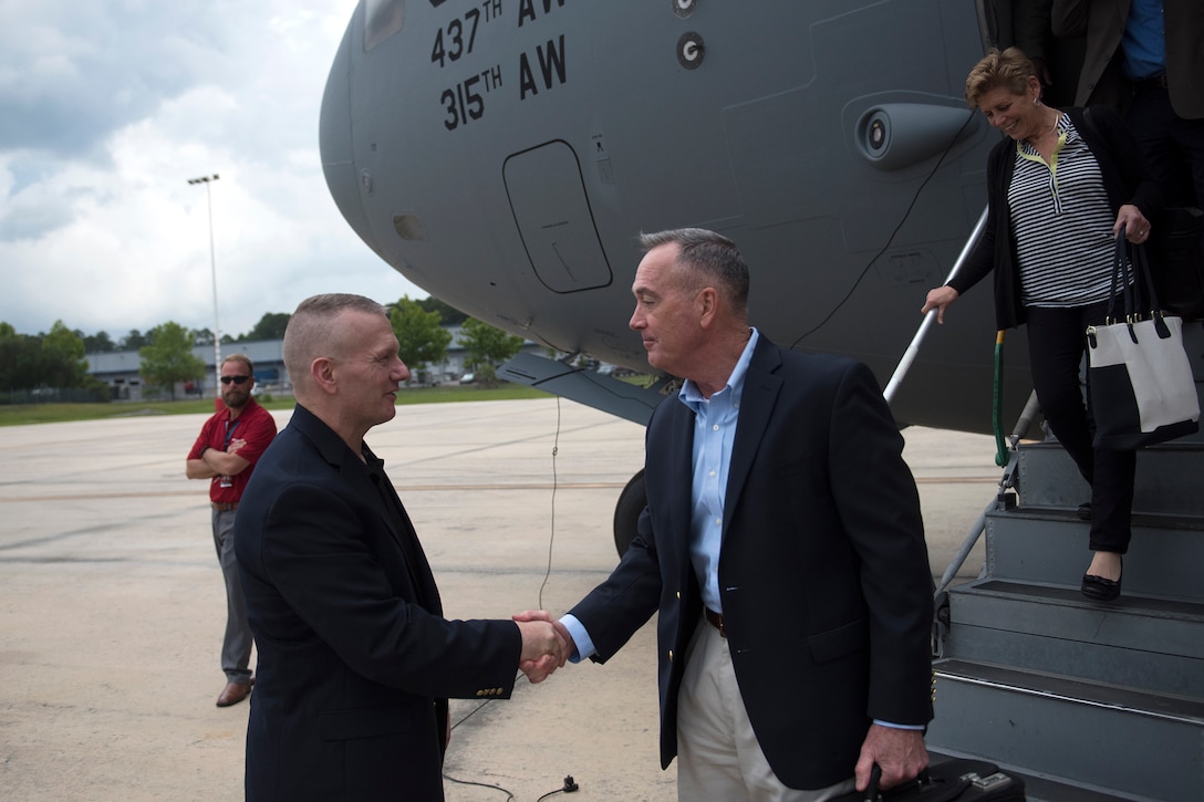 Army Command Sgt. Maj. John Troxell, the senior enlisted advisor to the chairman, greets Marine Gen. Joe Dunford and his wife Ellyn as they arrive in Jacksonville, Fla., May 19, 2016. Dunford and Troxell will meet with sailors at Naval Submarine Base Kings Bay, Ga., to visit facilities and gain perspective on the sea portion of the nuclear triad. DoD photo by D. Myles Cullen