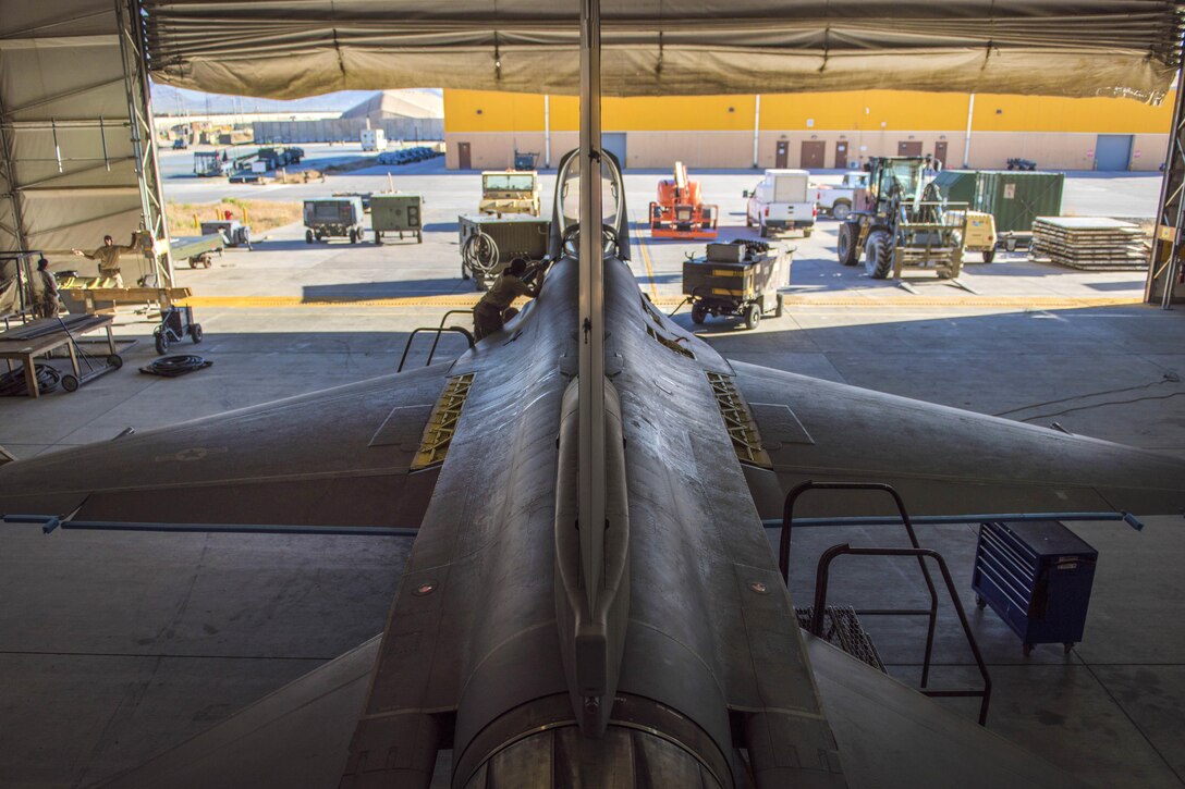 Airmen work on an F-16C Fighting Falcon aircraft during routine phase maintenance at Bagram Airfield, Afghanistan, May 18, 2016. Air Force photo by Senior Airman Justyn M. Freeman