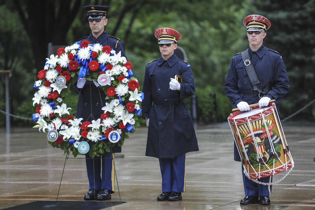 Soldiers from the 3rd U.S. Infantry Regiment (The Old Guard) perform ceremonial drills during a wreath-laying ceremony  at the Tomb of the Unknown Soldier to commemorate National Armed Forces Day in Arlington National Cemetery, Arlington, Va., May 21, 2016.  DoD photo by Marvin D. Lynchard
