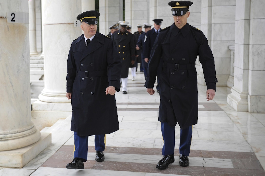 Army Command Sgt. Maj. John W. Troxell, left, senior enlisted advisor to the chairman of the Joint Chiefs of Staff, walks to the Tomb of the Unknown Soldier for a wreath-laying ceremony to commemorate National Armed Forces Day in Arlington National Cemetery, Arlington, Va., May 21, 2016. DoD photo by Marvin D. Lynchard