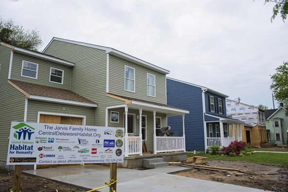 Reservists from the 512th Airlift Wing's Civil Engineer squadron help build a home in downtown Dover, Del., May 22, 2016, alongside the nonprofit Habitat for Humanity to provide housing forindividuals and families in need. The house build is able to satisfy certain training requirements needed for 512th CE Airmen while also providing a real-world benifit to families in the local community. (U.S. Air Force photo/Capt. Bernie Kale)