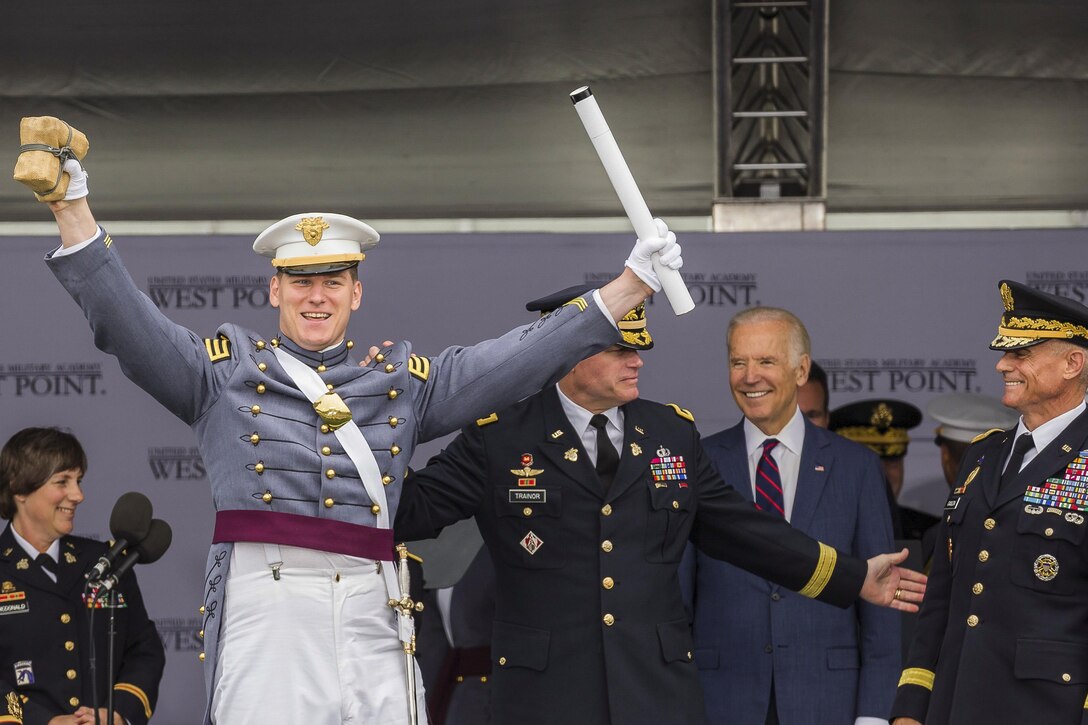 Vice President Joe Biden smiles as Army Cadet Alex Fletcher celebrates being named the Goat of the U.S. Military Academy’s Class of 2016, in West Point, N.Y., May 21, 2016. The Goat is the last-ranking cadet to graduate and usually receives the loudest applause from the class. Biden delivered the speech at the academy's commencement ceremony. Army photo by Staff Sgt. Vito T. Bryant