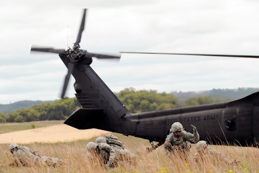 Soldiers conduct air assault training at Fort McCoy, Wis., May 15, 2016. The soldiers are assigned to the Wisconsin Army National Guard's 1st Battalion, 128th Infantry Regiment, 32nd Infantry Brigade Combat Team, and 1st Battalion, 147th Aviation Regiment. Army National Guard photo by Sgt. Kimberly Mianecki