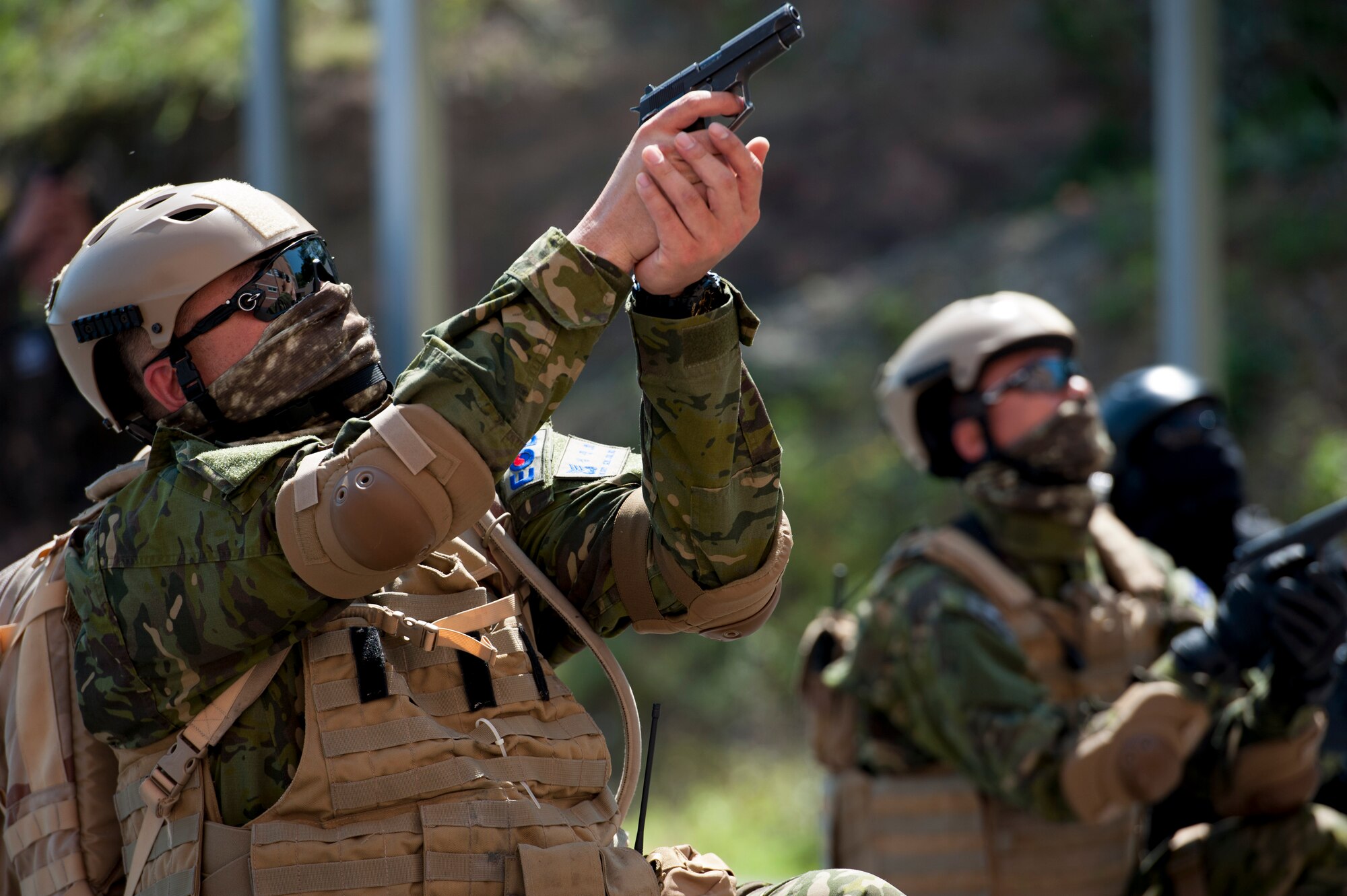 Republic of Korea air force military police members and explosive ordnance disposal technicians from Air Training Command aim their weapons during a mock terrorism situation at an Improvised Explosive Device Training Center, Air Force Education Training Command Base, Republic of Korea, May 18, 2016. The demonstration was part of Combined Joint IED Disposal Training, which allowed U.S. and ROK EOD technicians to come together to share tactics and techniques. (U.S. Air Force photo by Staff Sgt. Jonathan Steffen/Released)