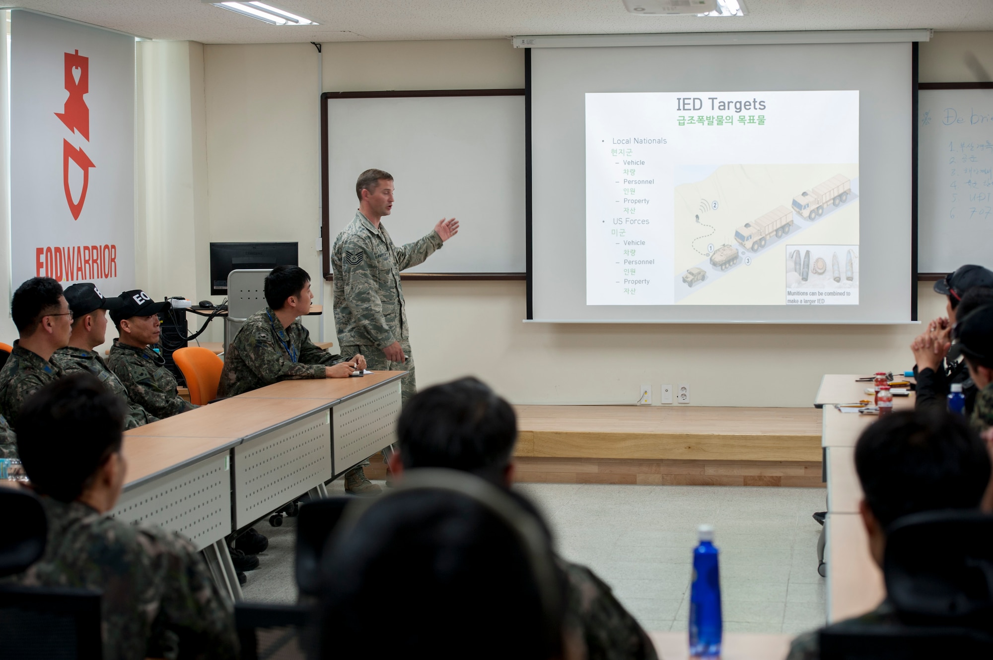 U.S. Air Force Tech. Sgt. Brandon Parrish, 8th Civil Engineer Squadron explosive ordnance disposal quality assurance, briefs Republic of Korea EOD technicians on improvised explosive devices encountered in Iraq and Afghanistan at an IED Training Center in the Air Force Education Training Command Base, Republic of Korea, May 18, 2016. U.S. Air Force explosive ordnance disposal technicians from Osan and Kunsan Air Base shared their knowledge of counter IED tactics to ROK EOD technicians during the Combined Joint IED Disposal Training. (U.S. Air Force photo by Staff Sgt. Jonathan Steffen/Released)
