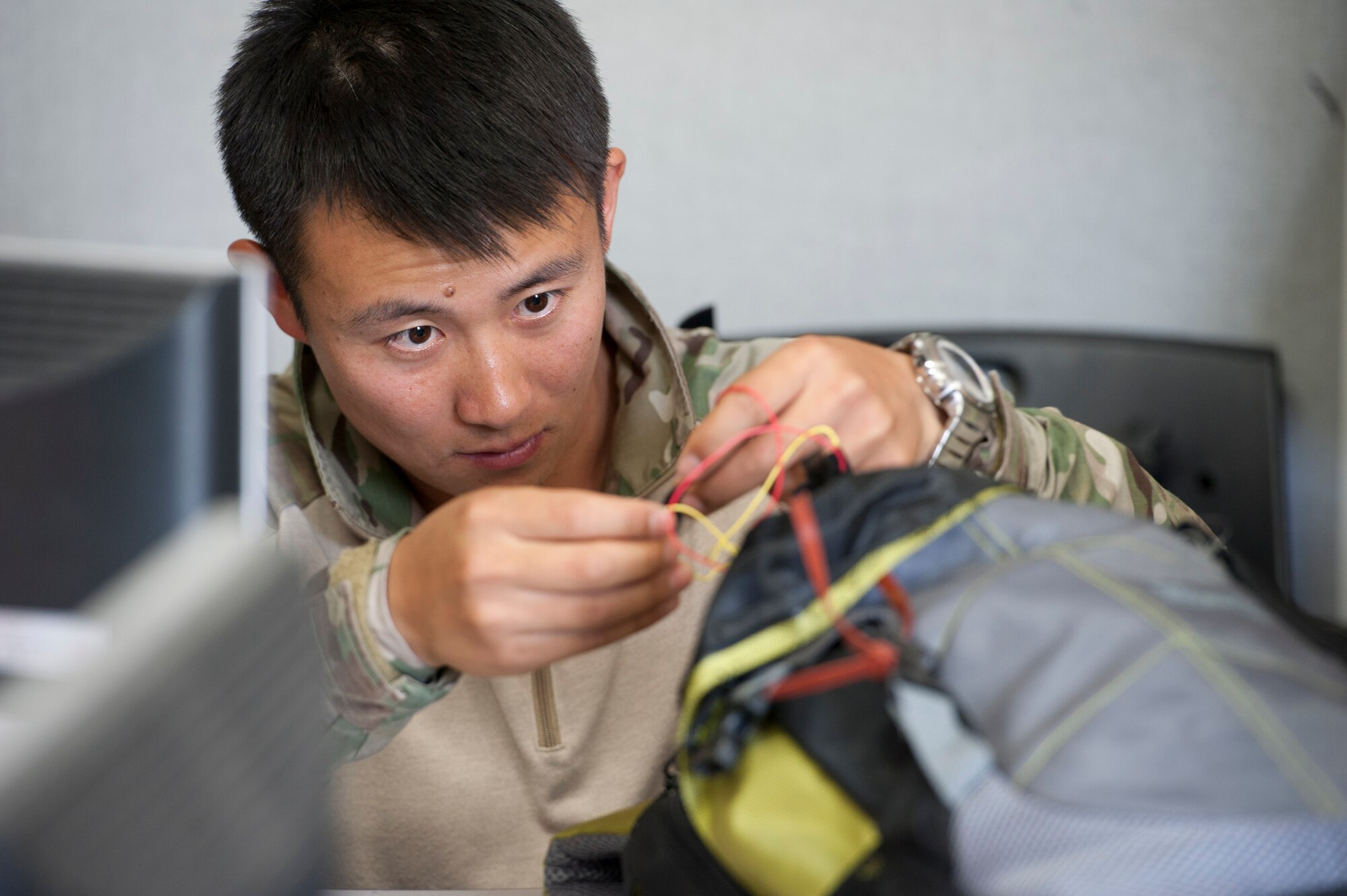 Republic of Korea navy Chief Petty Officer Bae Keun-Soo, Under Water Demolition Team SEAL, works on disposing of mock improvised explosive device during Combined Joint IED Disposal Training at Air Force Education Training Command Base, Republic of Korea, May 18, 2016. U.S. Air Force Explosive ordnance technicians from the 51st Civil Engineer squadron built the mock IED to test the tactics and techniques of ROK EOD techs. (U.S. Air Force photo by Staff Sgt. Jonathan Steffen/Released)