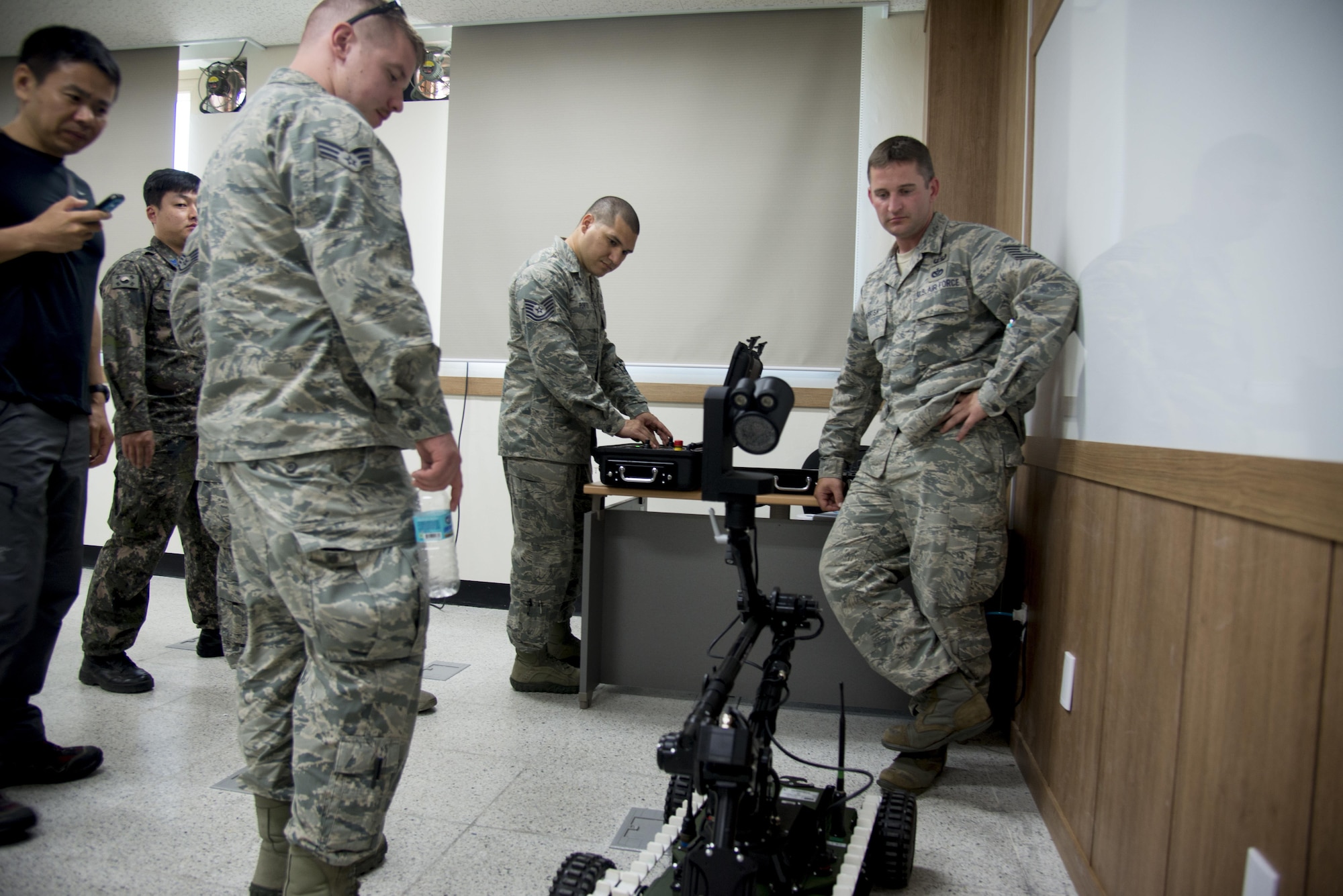 U.S. Air Force Tech. Sgt. Ricardo Portocastro, 51st Civil Engineer Squadron explosive ordinance disposal logistics NCO in charge, operates an EOD robot at Combined Joint Improvised Explosive Device Disposal Training on May 18, 2016, Air Force Education Training Command Base, Republic of Korea. The training allowed ROK and U.S. EOD techs to share tactics and techniques on defeating IEDs. (U.S. Air Force photo by Staff Sgt. Jonathan Steffen/Released)