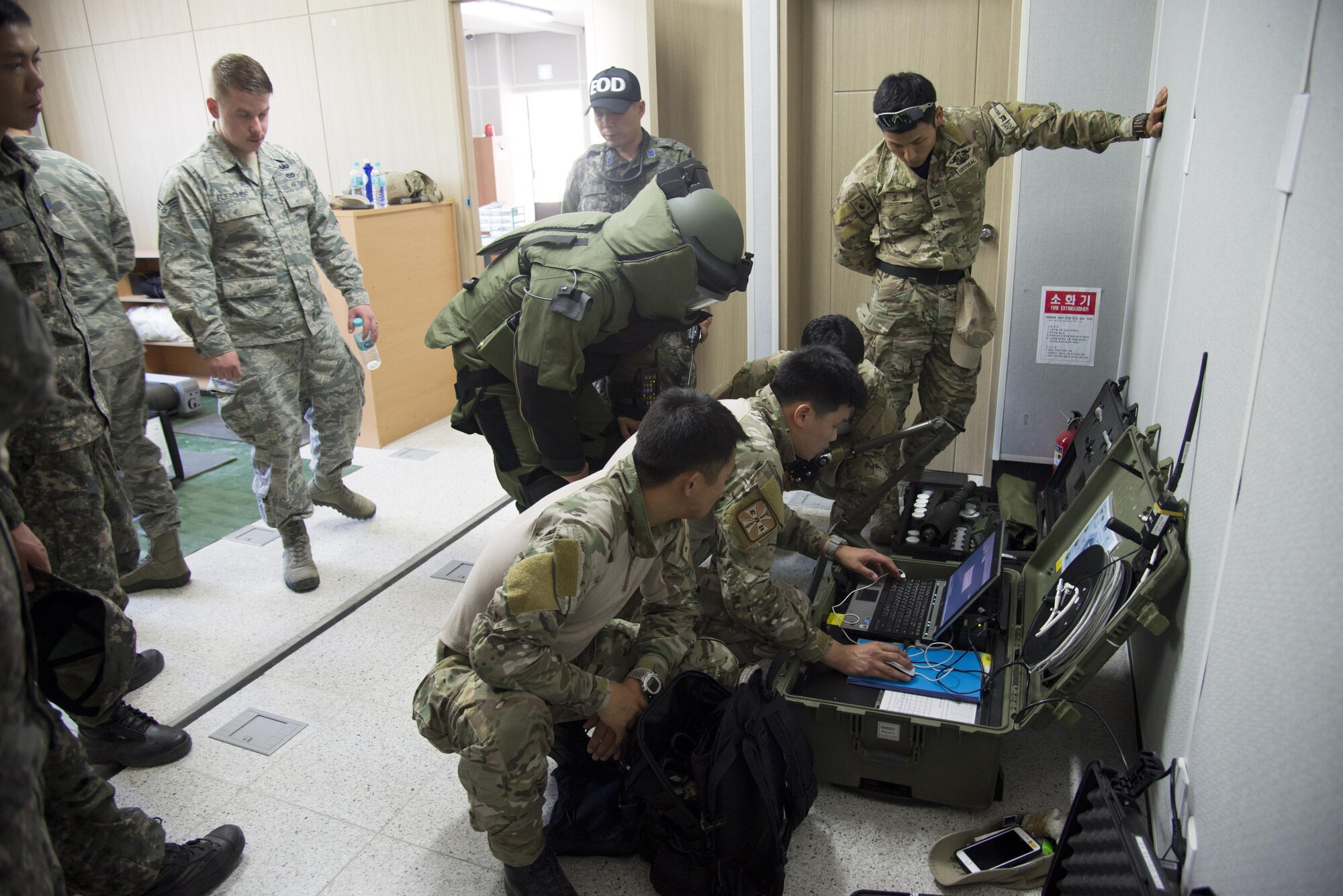 Republic of Korea navy Under Water Demolition Team SEALs, review an X-ray of a mock improvised explosive device during Combined Joint IED Disposal Training on May 18, 2016, Air Force Education Training Command Base, Republic of Korea. U.S. Air Force explosive ordnance technicians from 51st Civil Engineer squadron built the mock IED to test the tactics and abilities of ROK EOD technicians. (U.S. Air Force photo by Staff Sgt. Jonathan Steffen/Released)