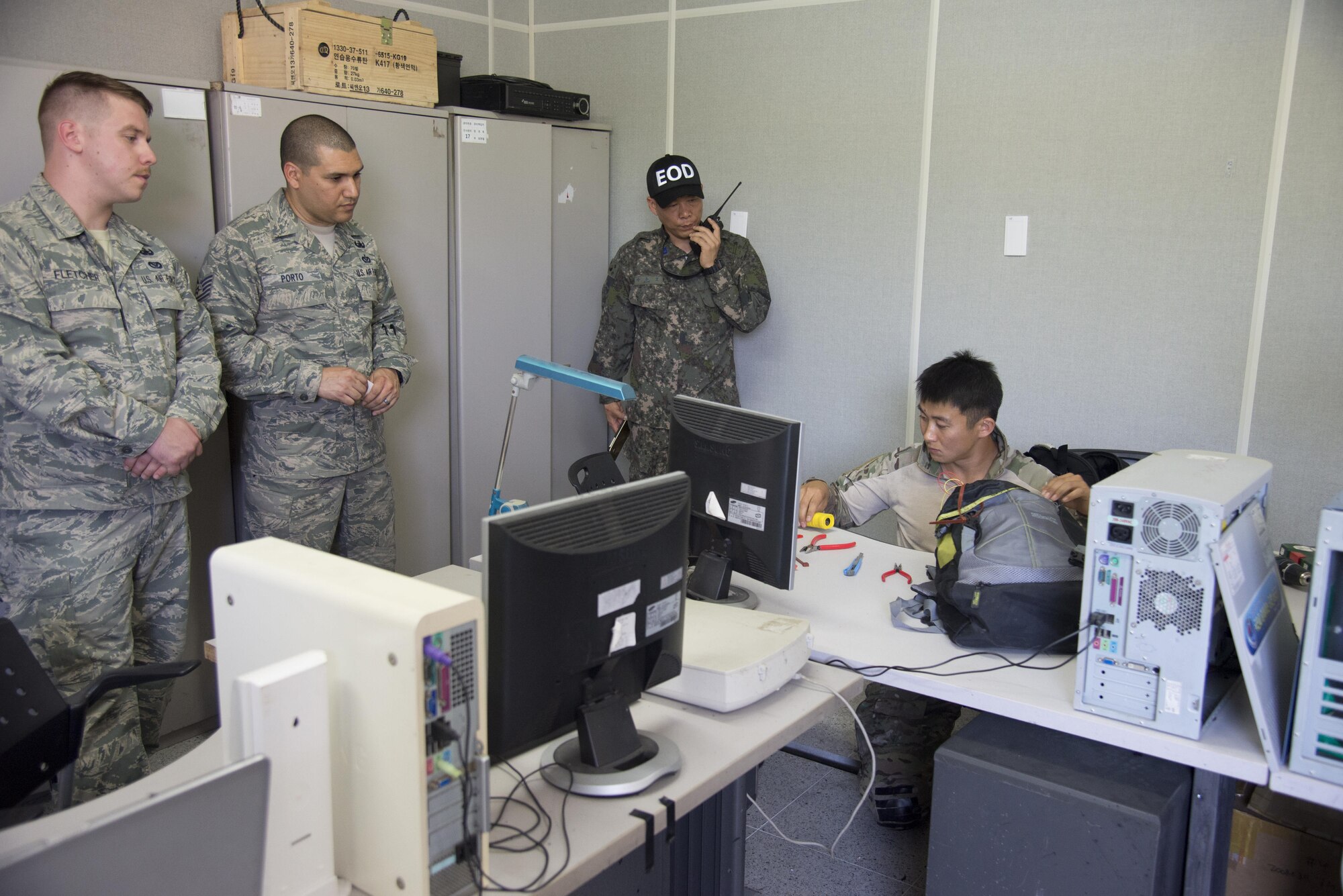 Republic of Korea navy Chief Petty Officer Bae Keun-Soo, SEAL Under Water Demolition Team, works on defusing of mock improvised explosive device during Combined Joint IED Disposal Training, Air Force Education Training Command Base, Republic of Korea, May 18, 2016. U.S. Air Force Explosive ordnance technicians from the 51st Civil Engineer squadron built the mock IED to test the tactics and techniques of ROK EOD technicians. (U.S. Air Force photo by Staff Sgt. Jonathan Steffen/Released)