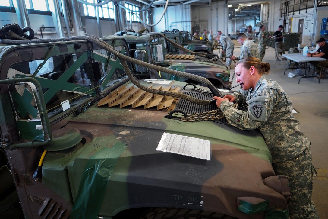 Army Sgt. 1st Class Rebecca Walker participates in slingload operations training under U.S. Army Pathfinder School instructors at Joint Base Elmendorf-Richardson, Alaska, May 18, 2016. Walker is assigned to the 25th Infantry Division’s Headquarters Company, 725th Brigade Support Battalion, 4th Infantry Brigade Combat Team (Airborne). The Army Pathfinder School provides a three-week course in which students establish and operate drop zones and a helicopter landing zone, conduct slingload operations, and provide air traffic control and navigational assistance to rotary and fixed-wing aircraft. Air Force photo by Justin Connaher