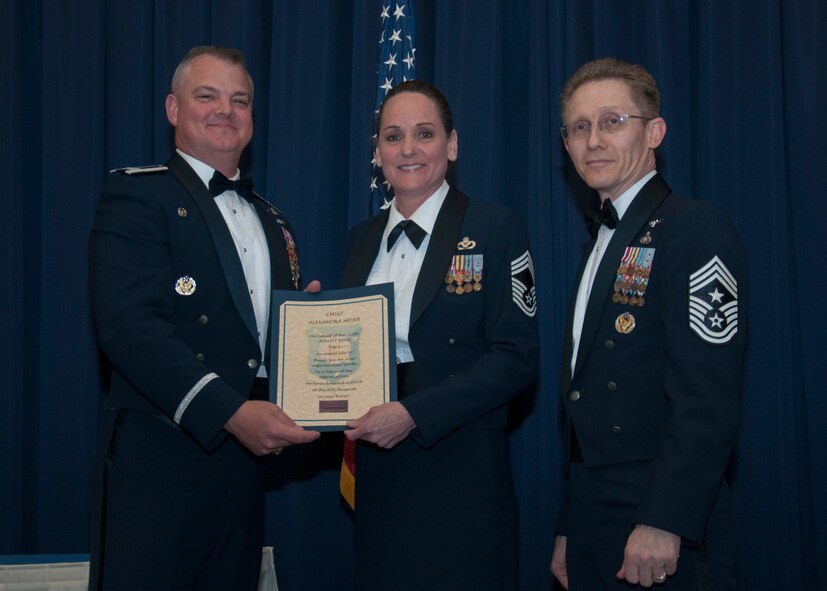 Senior non-commissioned officers with the 512th Airlift Wing, are inducted into the senior enlisted ranks during a ceremony at Dover Air Force Base, Del., May 21, 2016. The event and passing through a sabre arch recognizes the leadership positions the SNCOs now possess as they will lead Airmen in the future. (U.S. Air Force Photo/ Tech. Sgt. Nathan Rivard)