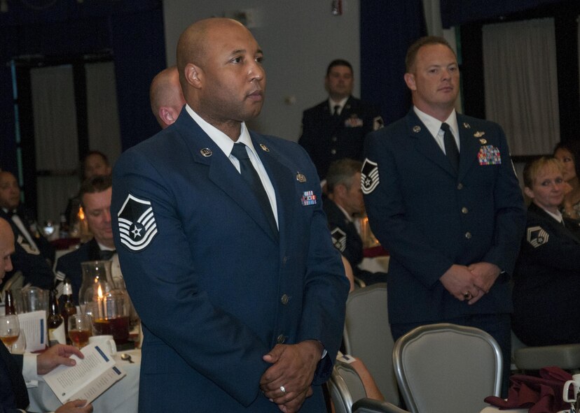 Senior non-commissioned officers with the 512th Airlift Wing, are inducted into the senior enlisted ranks during a ceremony at Dover Air Force Base, Del., May 21, 2016. The event and passing through a sabre arch recognizes the leadership positions the SNCOs now possess as they will lead Airmen in the future. (U.S. Air Force Photo/ Tech. Sgt. Nathan Rivard)