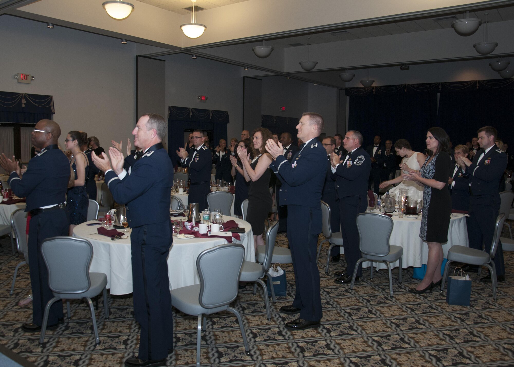 Senior non-commissioned officers with the 512th Airlift Wing, are inducted into the senior enlisted ranks during a ceremony at Dover Air Force Base, Del., May 21, 2016. The event and passing through a sabre arch recognizes the leadership positions the SNCOs now possess as they will lead Airmen in the future. (U.S. Air Force Photo/ Tech. Sgt. Nathan Rivard)