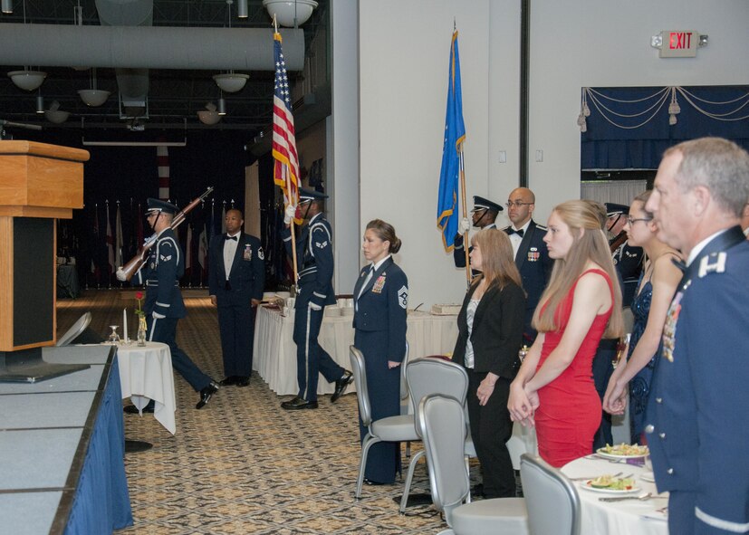 Senior non-commissioned officers with the 512th Airlift Wing, are inducted into the senior enlisted ranks during a ceremony at Dover Air Force Base, Del., May 21, 2016. The event and passing through a sabre arch recognizes the leadership positions the SNCOs now possess as they will lead Airmen in the future. (U.S. Air Force Photo/ Tech. Sgt. Nathan Rivard)