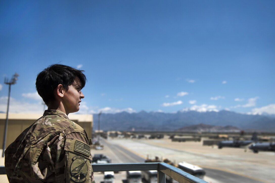 Air Force Airman 1st Class Angelena Legate looks out over the flightline from an observation tower at Bagram Airfield, Afghanistan, May 16, 2016. Legate is a weather forecaster assigned to the 455th Expeditionary Operations Support Squadron. Air Force photo by Senior Airman Justyn M. Freeman