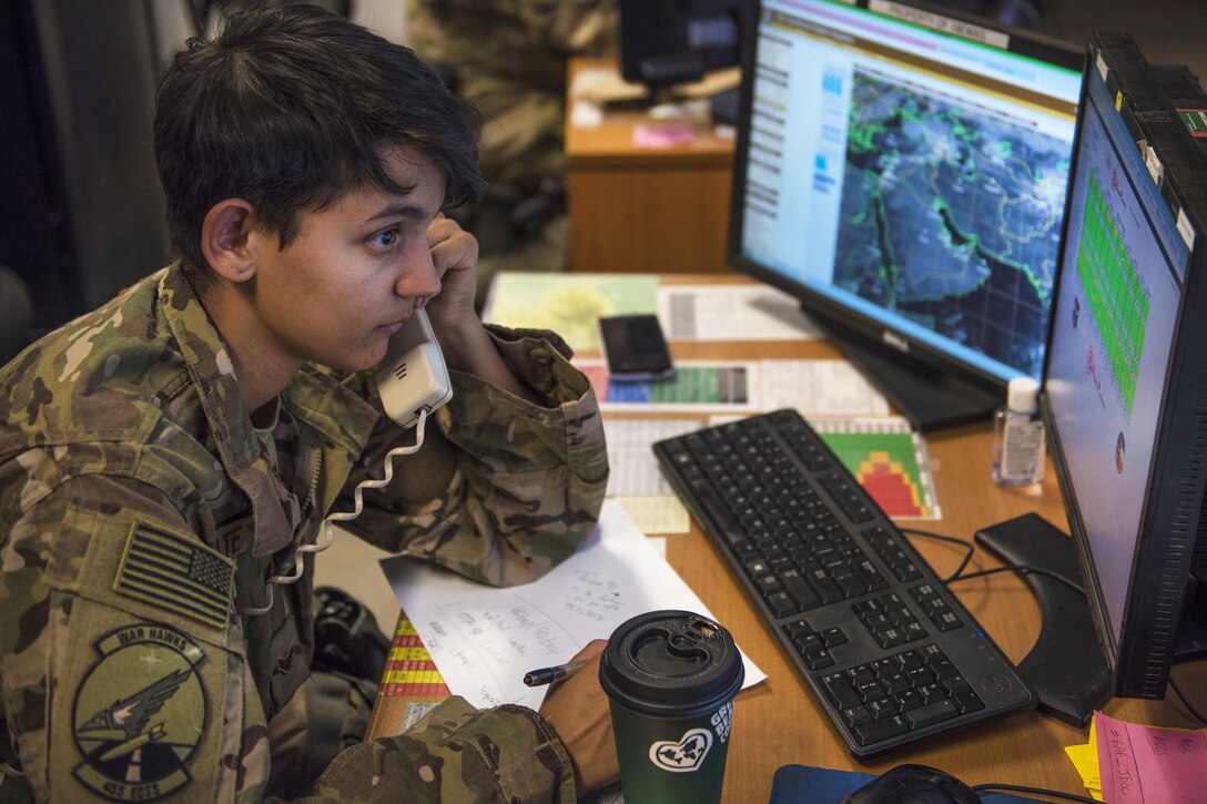 Air Force Airman 1st Class Angelena Legate provides weather updates to a customer at Bagram Airfield, Afghanistan, May 16, 2016. Legate is a weather forecaster assigned to the 455th Expeditionary Operations Support Squadron. Air Force photo by Senior Airman Justyn M. Freeman