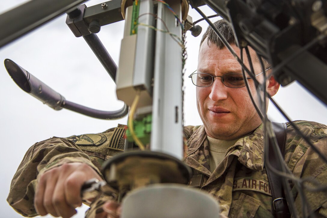Air Force Tech. Sgt. Heinz Disch tightens a bolt on a tactical meteorological observation system during routine maintenance at Bagram Airfield, Afghanistan, May 16, 2016. Disch is a weather forecaster assigned to the 455th Expeditionary Operations Support Squadron. Air Force photo by Senior Airman Justyn M. Freeman