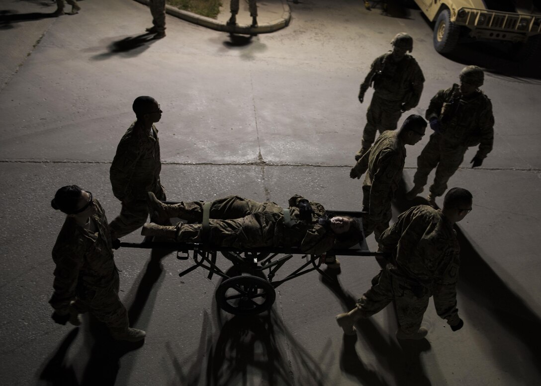 The 455th Expeditionary Medical Operations Squadron teams up with the U.S. Army "Dustoff" Medical Evacuation Unit during a mass casualty exercise at Bagram Airfield, Afghanistan, May 21, 2016. These exercises are conducted to ensure that first responders are prepared to react to an accident or emergency. (U.S. Air Force photo by Senior Airman Justyn M. Freeman)