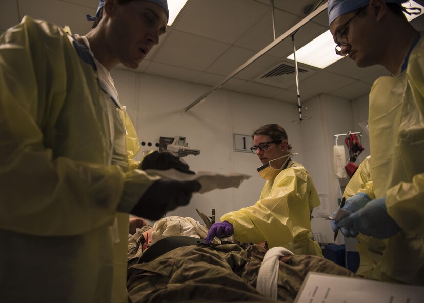 Members of the 455th Expeditionary Medical Group assess a mock victim during a mass casualty exercise at Bagram Airfield, Afghanistan, May 21, 2016. This exercise was conducted to test the medical readiness and skills of the squadron during an emergency to sharpen operational readiness. (U.S. Air Force photo by Senior Airman Justyn M. Freeman)