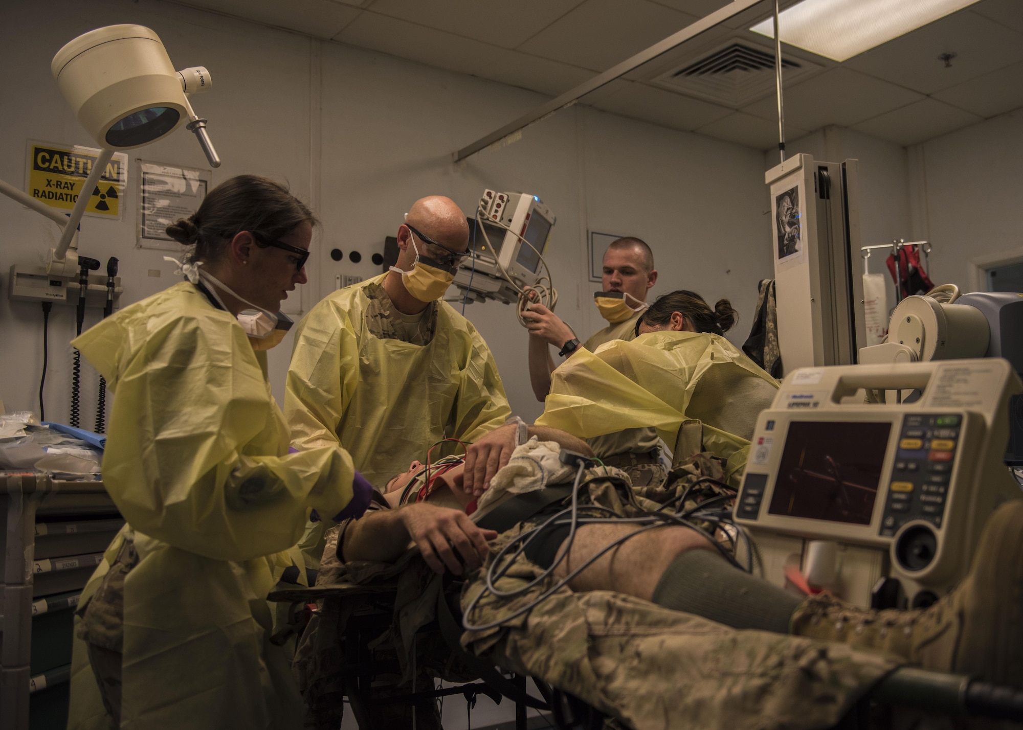 Members of the 455th Expeditionary Medical Group assess a mock victim during a mass casualty exercise at Bagram Airfield, Afghanistan, May 21, 2016. This exercise was conducted to test the medical readiness and skills of the squadron during an emergency to sharpen operational readiness. (U.S. Air Force photo by Senior Airman Justyn M. Freeman)