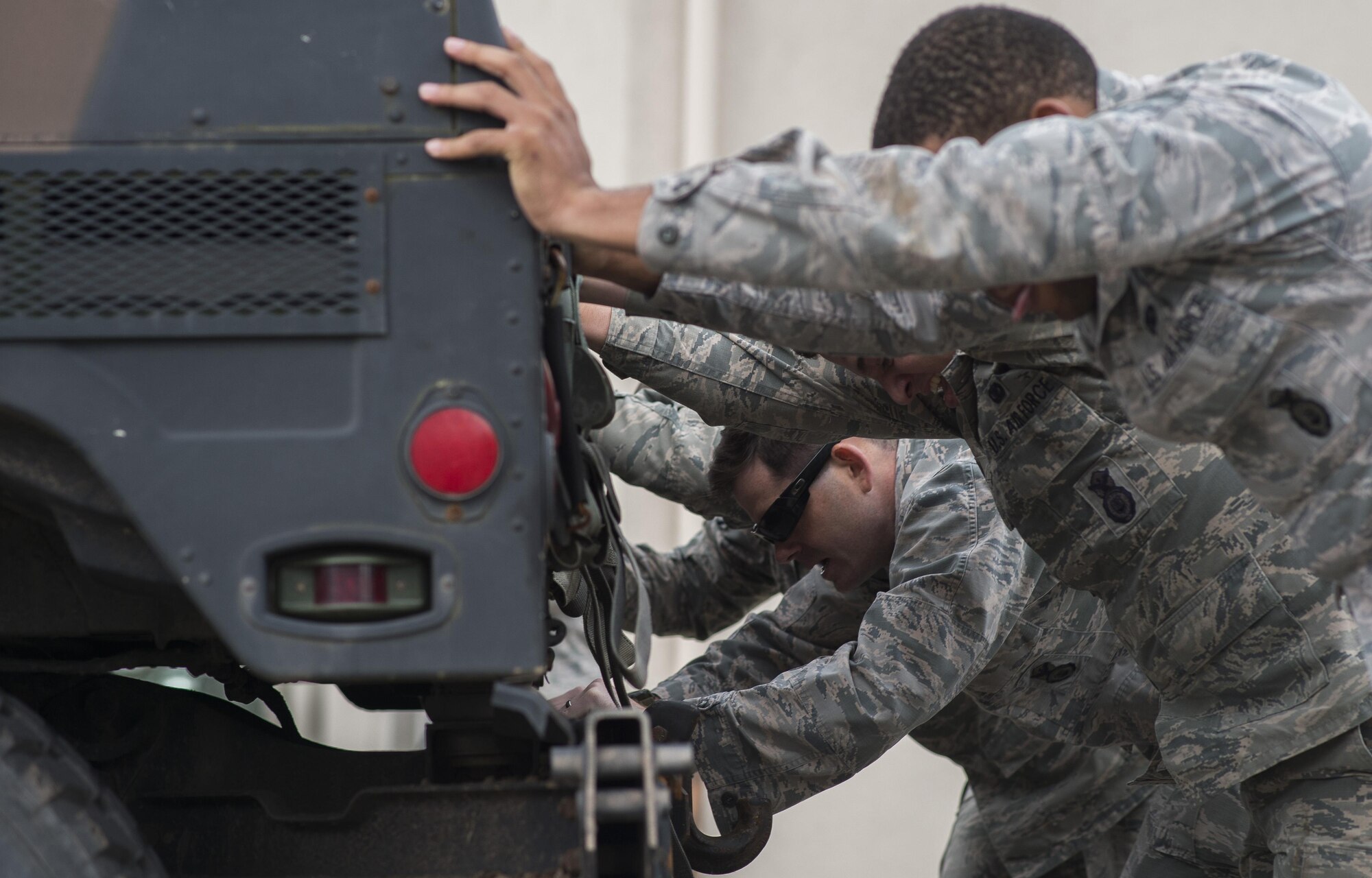 Security forces members participate in a pushup challenge during the Battle of the Badges competition May 19, 2016, at Ramstein Air Base, Germany. The competition was part of events held for National Police Week, which pays special recognition to those law enforcement officers who have lost their lives in the line of duty. (U.S. Air Force photo/Senior Airman Damon Kasberg)