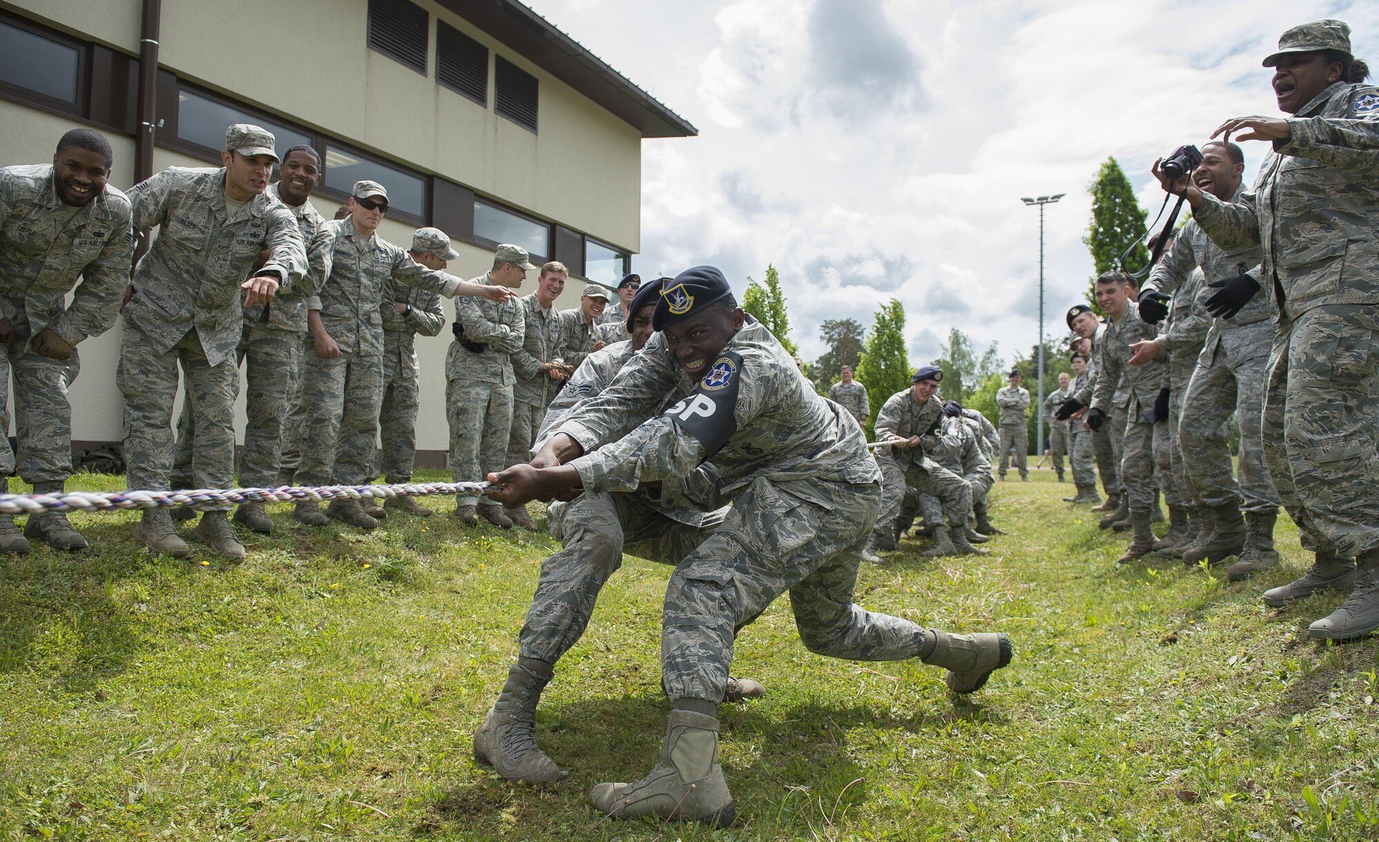Security forces members participate in a pushup challenge during the Battle of the Badges competition May 19, 2016, at Ramstein Air Base, Germany. The competition was part of events held for National Police Week, which pays special recognition to those law enforcement officers who have lost their lives in the line of duty. (U.S. Air Force photo/Senior Airman Damon Kasberg)