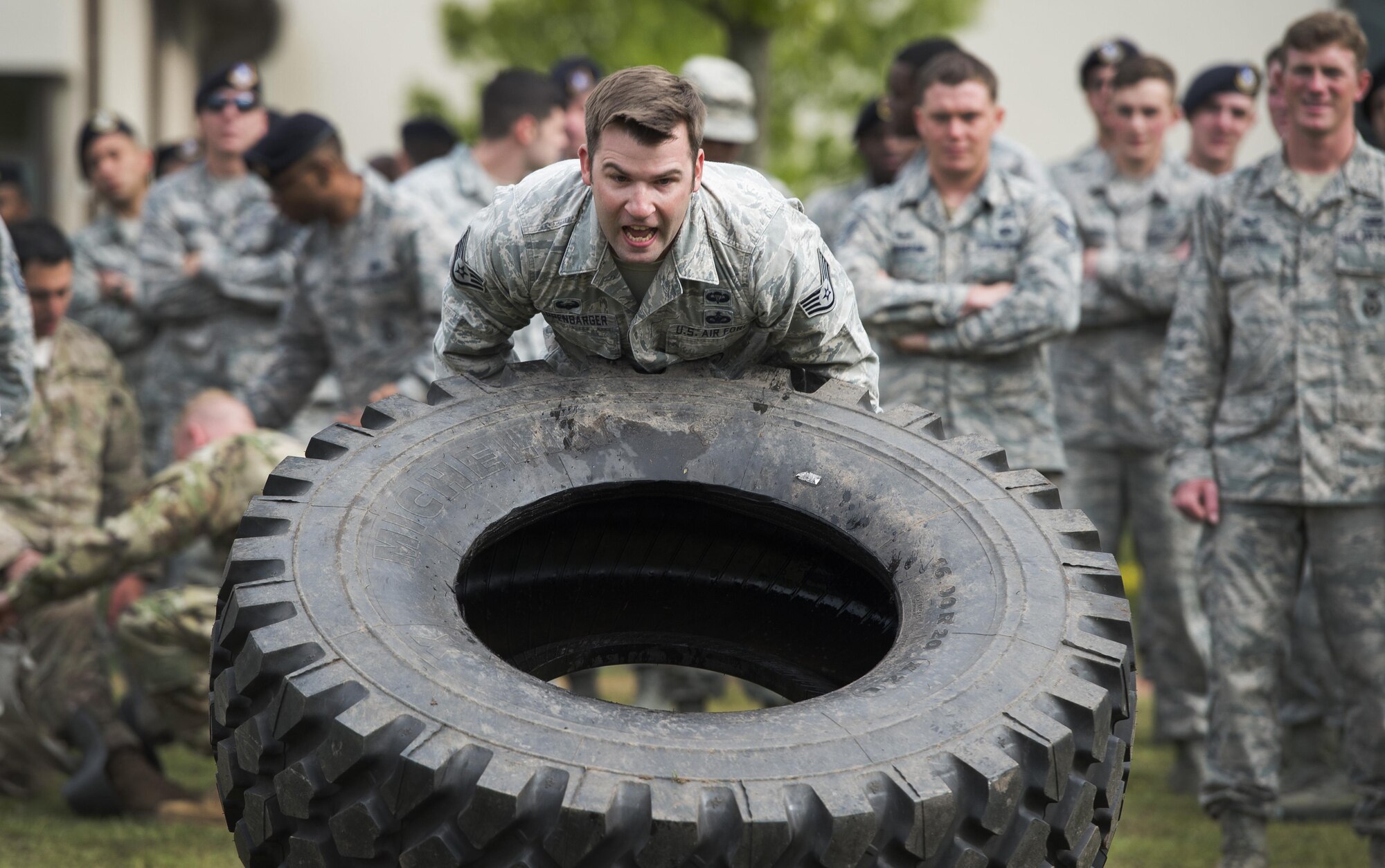 Security forces members participate in a pushup challenge during the Battle of the Badges competition May 19, 2016, at Ramstein Air Base, Germany. The competition was part of events held for National Police Week, which pays special recognition to those law enforcement officers who have lost their lives in the line of duty. (U.S. Air Force photo/Senior Airman Damon Kasberg)