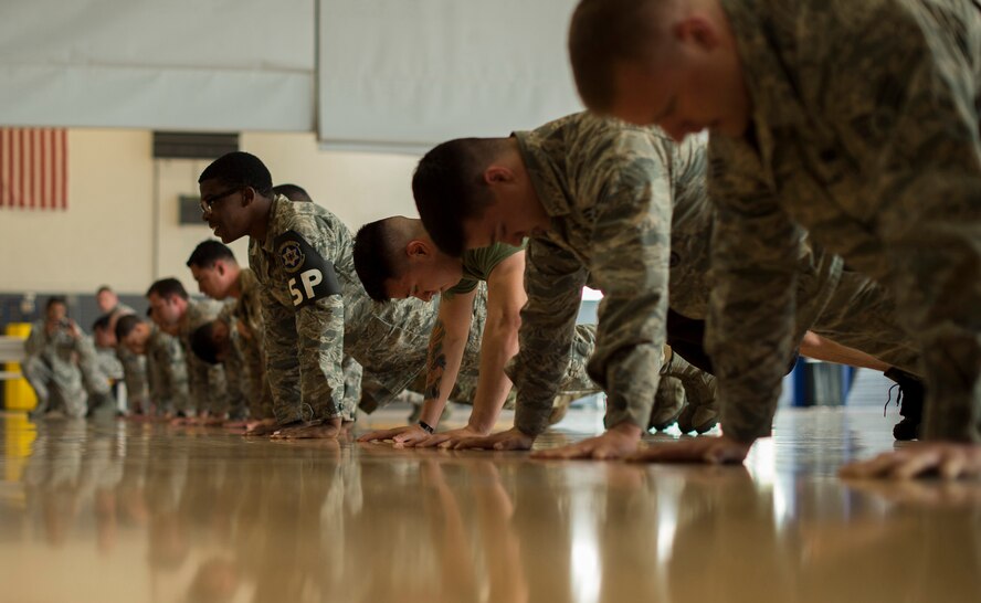 Security forces members participate in a pushup challenge during the Battle of the Badges competition May 19, 2016, at Ramstein Air Base, Germany. The competition was part of events held for National Police Week, which pays special recognition to those law enforcement officers who have lost their lives in the line of duty. (U.S. Air Force photo/Senior Airman Damon Kasberg)