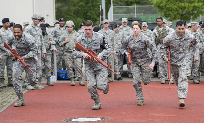 Security forces members participate in a pushup challenge during the Battle of the Badges competition May 19, 2016, at Ramstein Air Base, Germany. The competition was part of events held for National Police Week, which pays special recognition to those law enforcement officers who have lost their lives in the line of duty. (U.S. Air Force photo/Senior Airman Damon Kasberg)