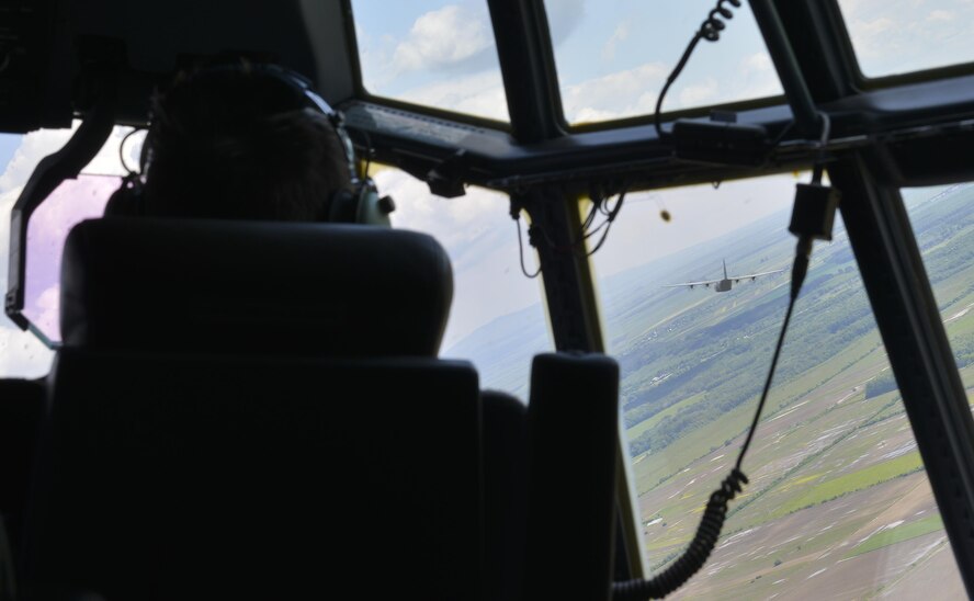 A C-130J Super Hercules flies in formation during an airfield seizure operation during Exercise Carpathian Spring May 18, 2016, over Romania. The airfield seizure operation demonstrated the shared commitment and close cooperation between the U.S. and its NATO allies on countering a range of regional and global threats. (U.S. Air Force photo/Airman 1st Class Lane T. Plummer) 