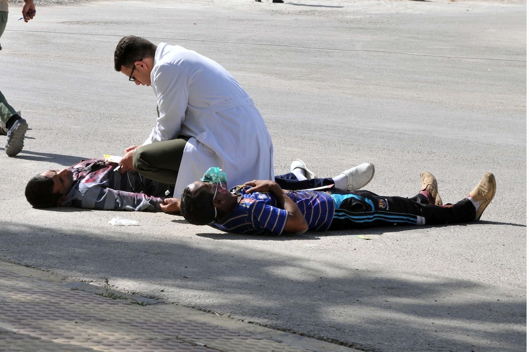 — A Jordanian Armed Forces doctor assesses simulated casualties during a mass casualty event May 21, 2016, at King Hussien Medical Centre. This exercise was part of Eager Lion 2016, which is a military bi-lateral exercise with the Hashemite Kingdom of Jordan designed to strengthen relationships and interoperability between partner nations.