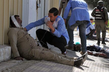 A Jordan Armed Forces member comforts and treats a simulated casualty during a massive casualty exercise May 21, 2016, at King Hussien Medical Centre, during Eager Lion ’16. Eager Lion 2016, which a military bi-lateral exercise with the Hashemite Kingdom of Jordan designed to strengthen relationships and interoperability between partner nations.